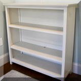 F34. Williams Sonoma white bookcase. 42”h x 14”w x 14”d 